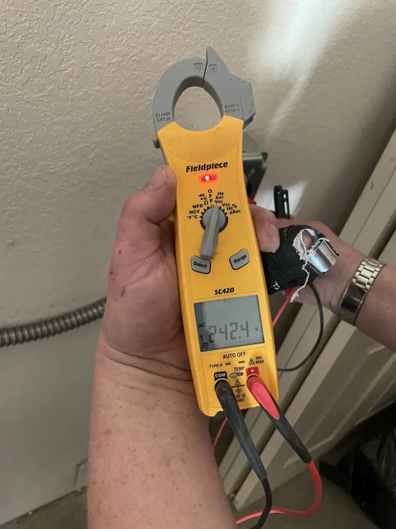 Voltage testing with clamp meter during Circuit Breaker Repair in Hudson